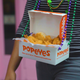 Illustration for article titled Popeyes might be onto something with chicken-tender-cradlin’ Mardi Gras beadsem/em